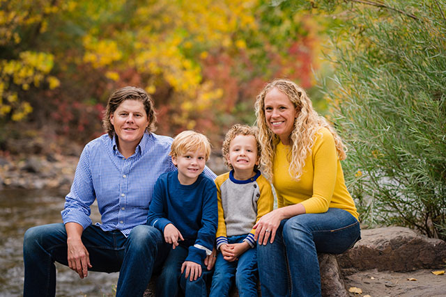 Family with fall colors in the background taken in Golden CO
